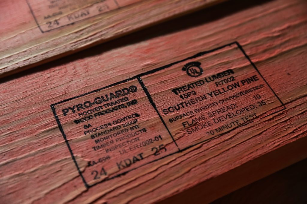 Close-up of Hoover’s PyroGuard Fire-Retardant-Treated Wood showing the product stamp on Southern Yellow Pine lumber, including flame spread and smoke developed ratings.