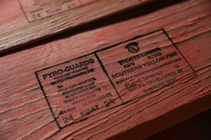 Close-up of Hoover’s PyroGuard Fire-Retardant-Treated Wood showing the product stamp on Southern Yellow Pine lumber, including flame spread and smoke developed ratings.